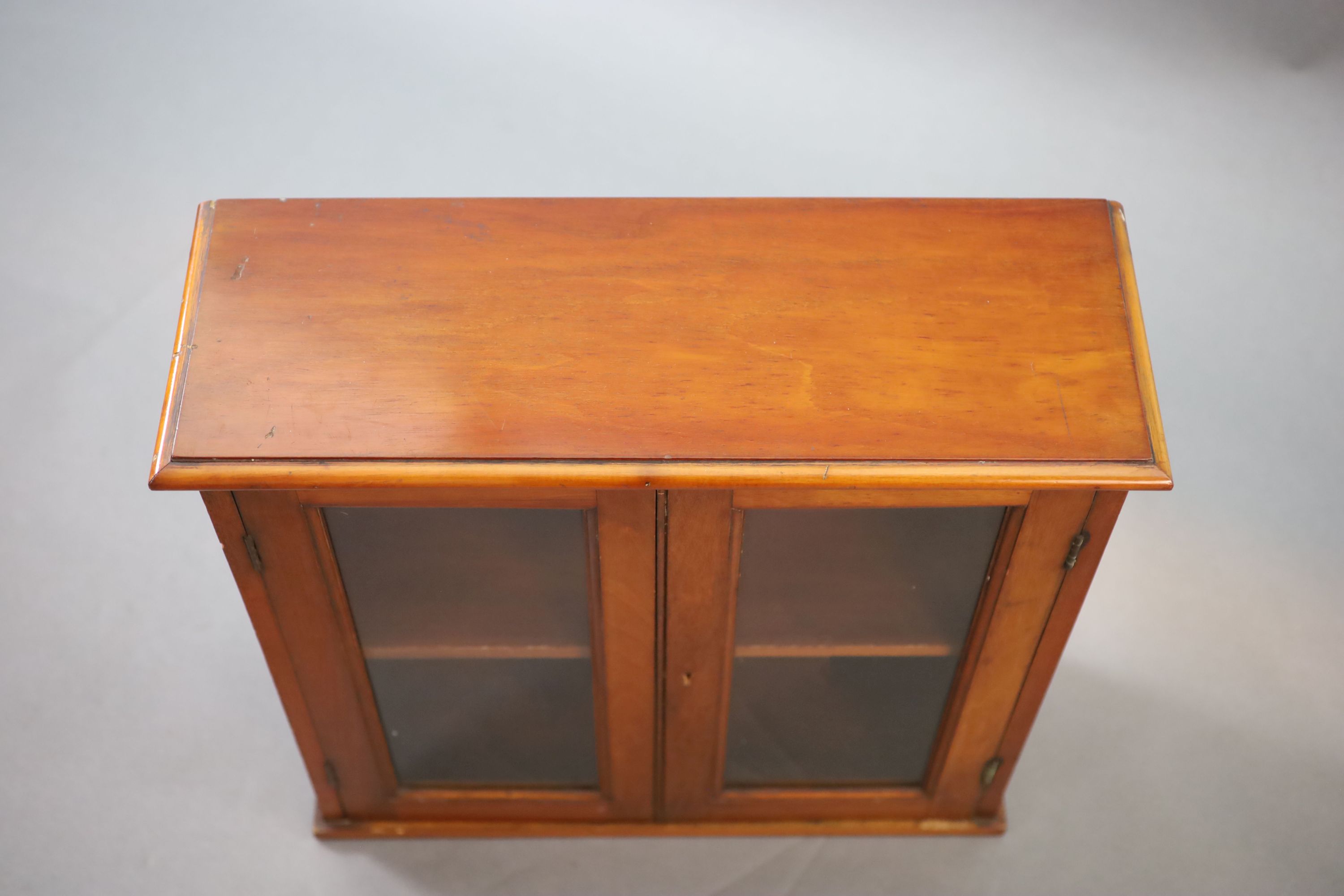 A small Edwardian mahogany wall cabinet, W.58cm D.21cm H.57cm